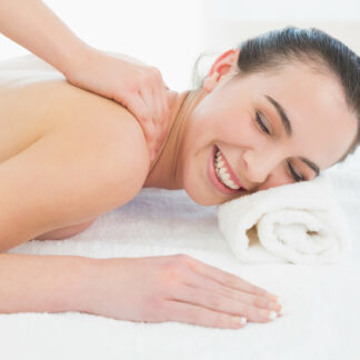 Close up of a beautiful woman enjoying back massage at beauty spa