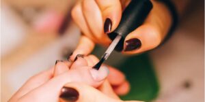 Close-up of vibrant and intricate nail art design by The Outcall Spa, showcased on beautifully manicured nails.